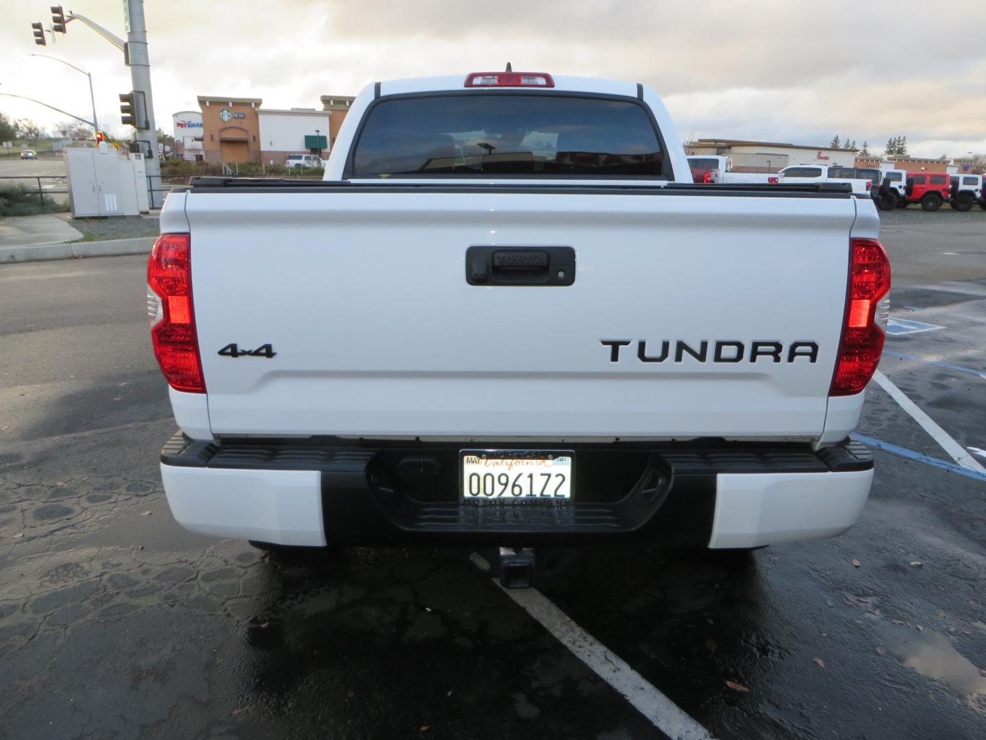 2020 White /BLACK Toyota Tundra SR5 5.7L V8 CrewMax 4WD (5TFDY5F12LX) with an 5.7L V8 DOHC 32V engine, 6A transmission, located at 2630 Grass Valley Highway, Auburn, CA, 95603, (530) 508-5100, 38.937893, -121.095482 - Clean tundra featuring a level kit, Icon Vehicle Dynamicxs upper control arms, 18" Method NV wheels, 35" BFG KO2 tires, Rocksliders, Retrax bedcover, Rigid Industries fog lights, RoadActive Suspension Custom Leaf Spring Enhancement Kit. - Photo#5